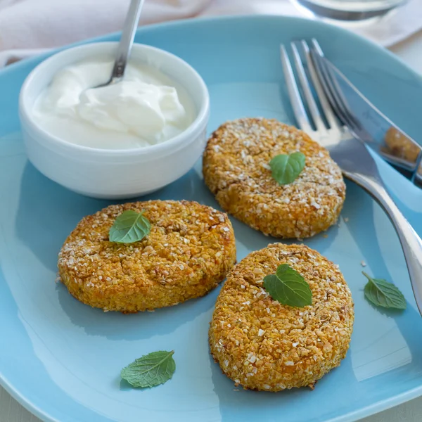 Healthy vegetable cutlets with carrot, dried apricots, almonds and herbs