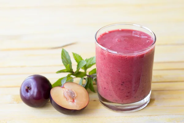 Plum smoothie with fresh plums and mint