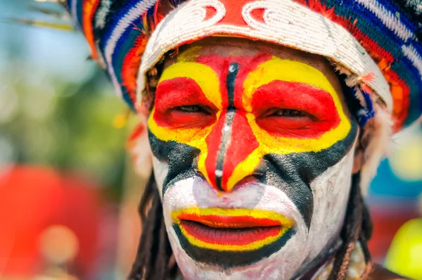 Colourful face of man in Papua New Guinea