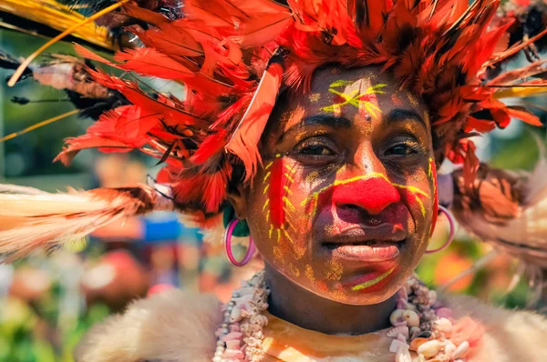 Woman with earrings in Papua New Guinea