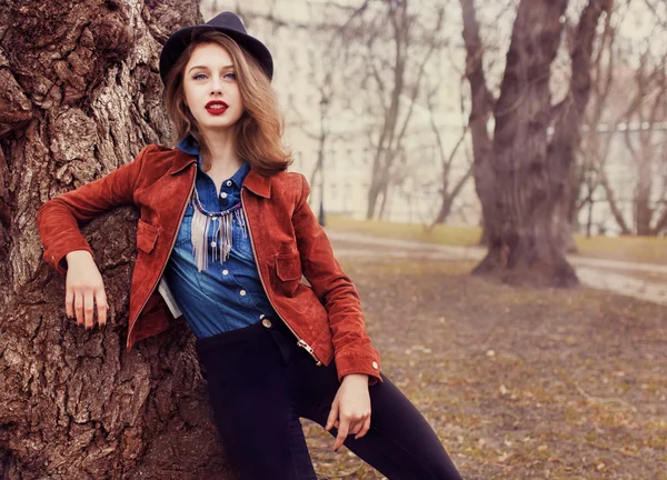 Street fashion concept. Vintage portrait of young woman.