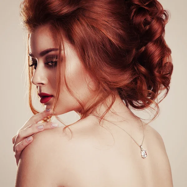 Vintage portrait of elegant beautiful red haired woman with even