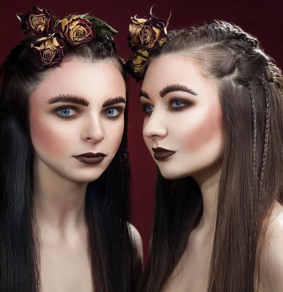 Two beautifull women with art wide eyebrows and brown lipstick a