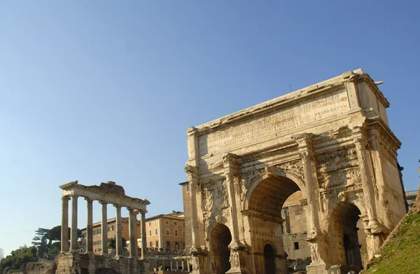 The ancient Forum with its temples and monuments is in the middle of the city of Rome Italy