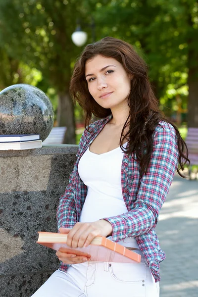 Girl holding a book in her hands