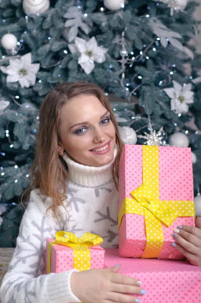 Girl holds the box with gifts