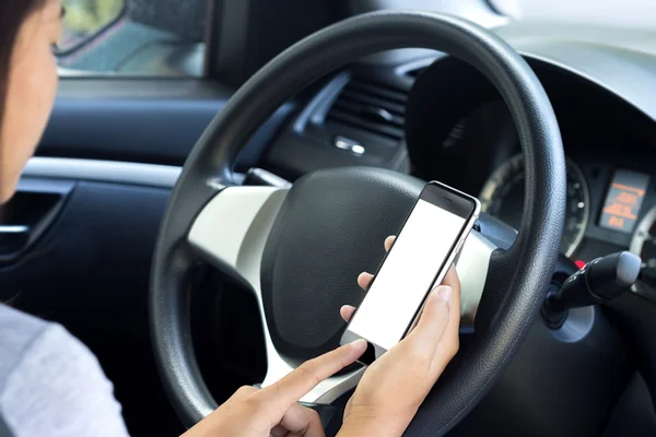 Woman using phone white screen in her car