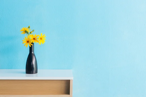 Jerusalem artichoke flower in vase on table interior design