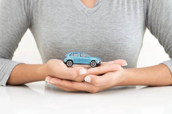 Woman holding car model business leasing concept