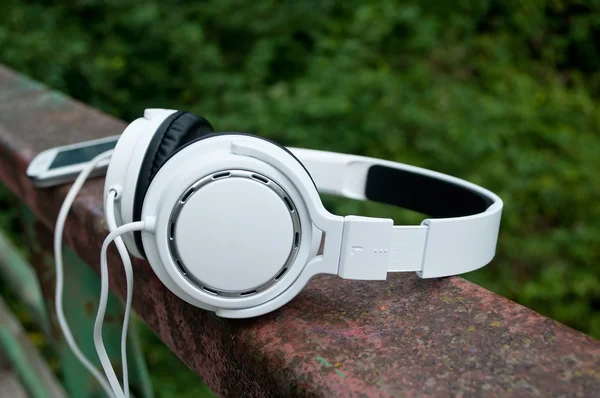 Closeup of white headphones in outdoor