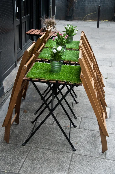 Restaurant terrace with artificial grass on the table