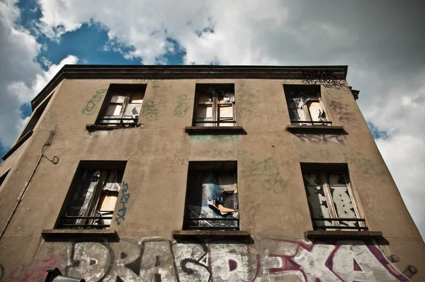 Abandoned building facade with graffiti