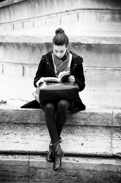 PARIS - France -     27 March 2013 - sexy student girl reading a book in st michel place in Paris