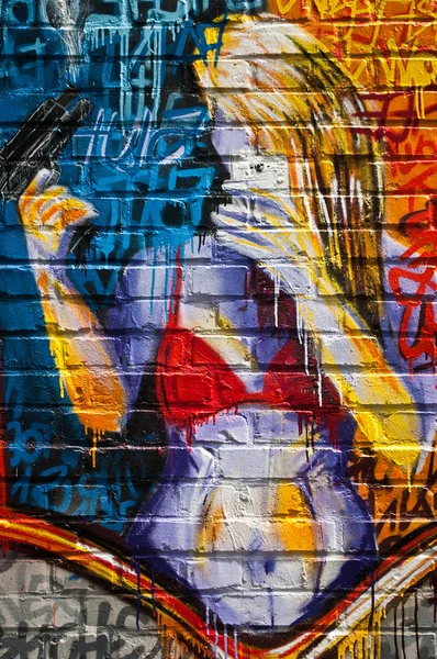 MULHOUSE - France - 08 June 2015 - graffiti of woman with shotgun  during the BOZAR graffiti festival - quay of sinners in Mulhouse