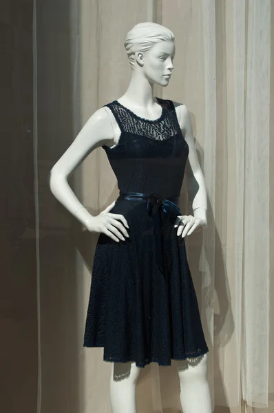 Mannequin with a blue dress in a showroom
