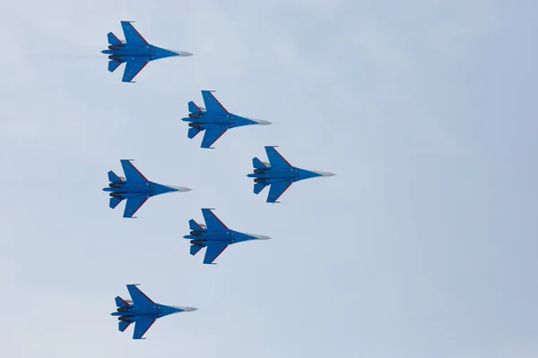 Aerobatics performed by aviation group of aerobatics Military-air forces Russian Knights on planes Su-27