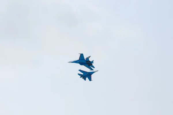 Aerobatics performed by aviation group of aerobatics Military-air forces Russian Knights on planes Su-27