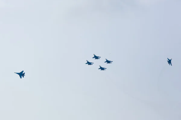 Aerobatics performed by aviation group of aerobatics Military-air forces Russian Knights on planes Su-27