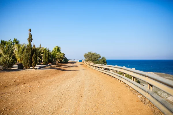 Curving dirt road near the Mediterranean sea, Cyprus.