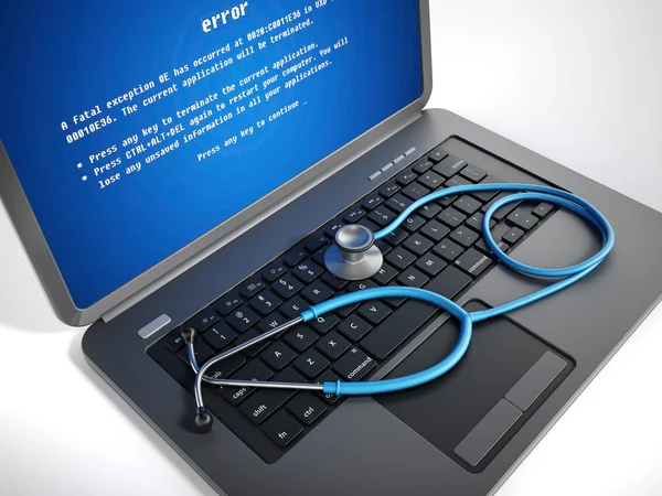 Stethoscope on laptop computer with a blue screen error on the display