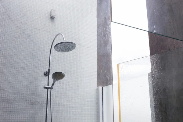 Shower head in bathroom, design of home interior