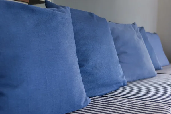 Blue pillow on sofa furniture decorated in living room