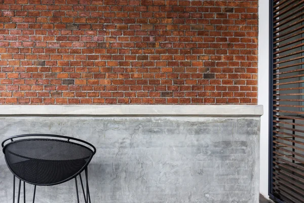 Design of interior, counter bar made from cement with iron seat