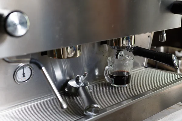 Coffee making process from coffee machine in cafe shop