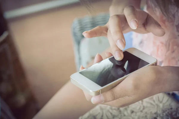 Women using a smart phone, hand touch on screen digital mobile,