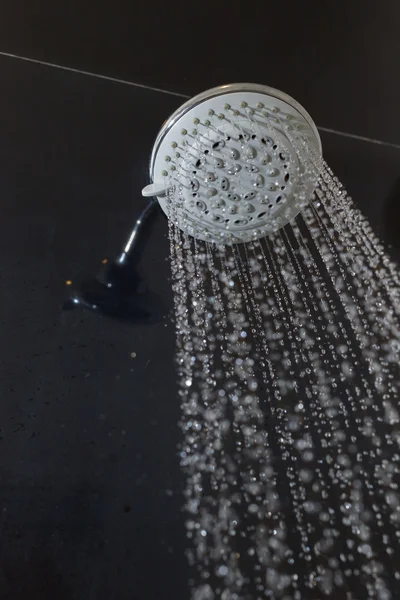 Shower head with water drops flowing
