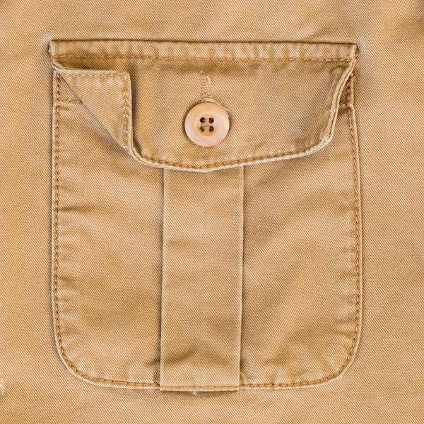Front pocket on brown shirt textile texture background
