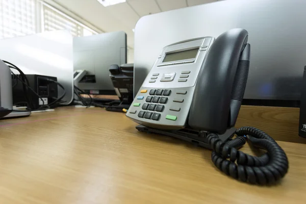 Black telephone on table work of office