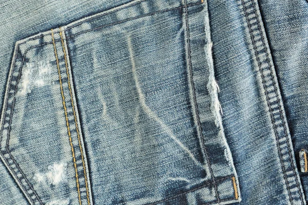 Back pocket of fashion blue jeans