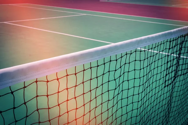 Green tennis court sport background, image used retro filter