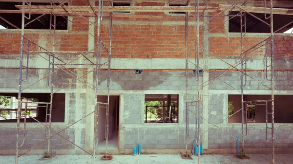 Building residential construction house with scaffold steel