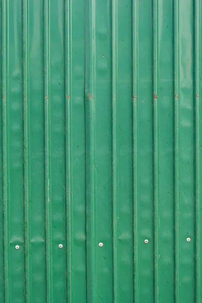 Steel metallic old door, green grunge metal background