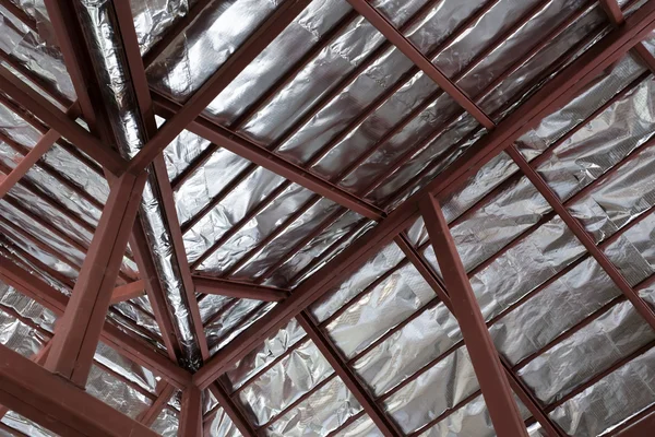 Roof with steel beam and silver foil insulation heat on ceiling