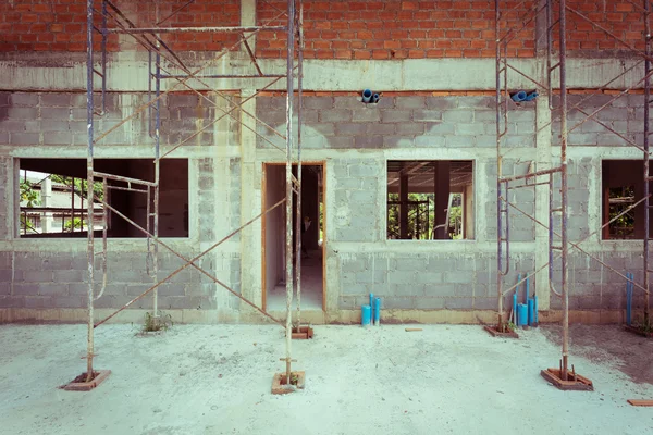 Building residential construction house with scaffold steel