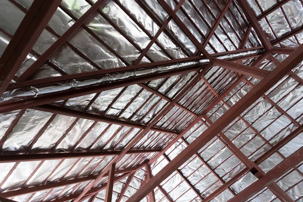 Roof with steel beam and silver foil insulation heat on ceiling