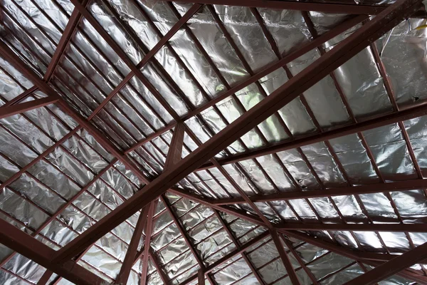 Roof with steel beam and silver foil insulation heat on ceiling