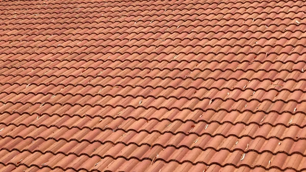 Brown tile roof weathered on building residential