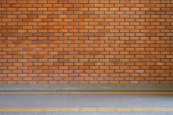 Brick wall texture background and small gravel stone washed