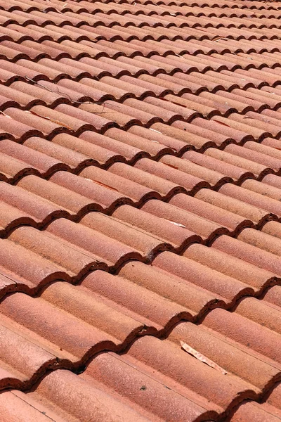 Brown tile roof weathered on building residential