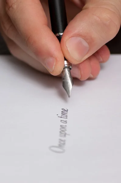 Fountain pen writing the words \