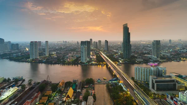 After sunset, aerial view over Bangkok main river bridge