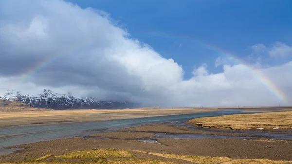 Rainbow curved after raining in Iceland