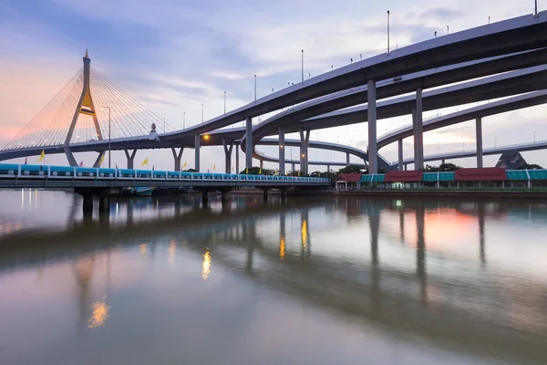 After sunset over suspension bridge connect to highway interchange