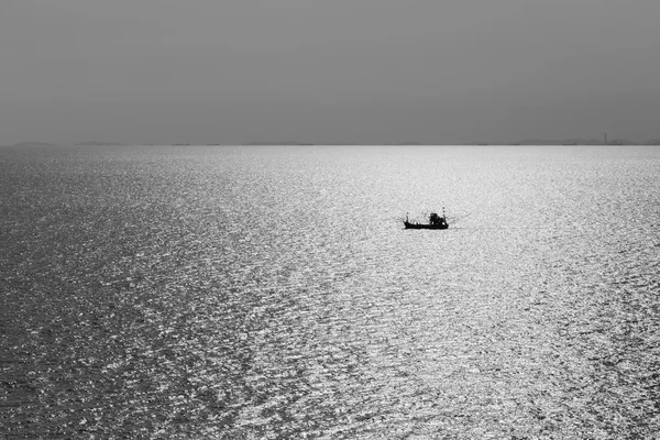 Black and White, Single fishing boat in the ocean