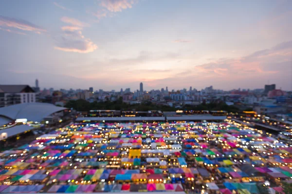 Blurred lights aerial view colourful weekend market