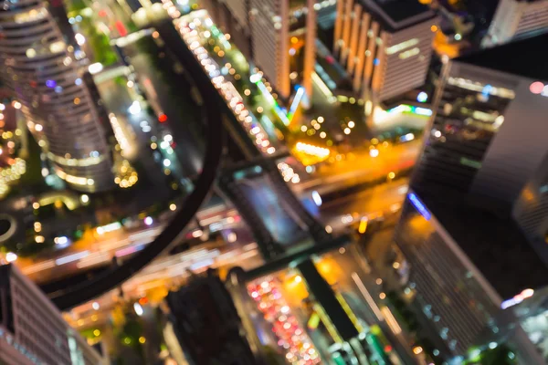 Abstract blurred lights, aerial view crossing road in city downtown